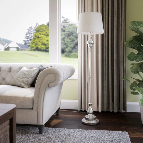 Tall Brushed Steel Floor Lamp With Classic Style, 59 Inch Height, in living room next to sofa, 15 Inch Drum Shade visible