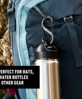 Backpack with stainless steel dual SBiner Clip Size 4 holding water bottle, perfect for hiking and camping gear.