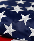 Close-up of Durable Outdoor US Flag 4x6 Ft Built For Weather Heavy Duty 210D Nylon Embroidered Stars Sewn Stripes Brass Grommets