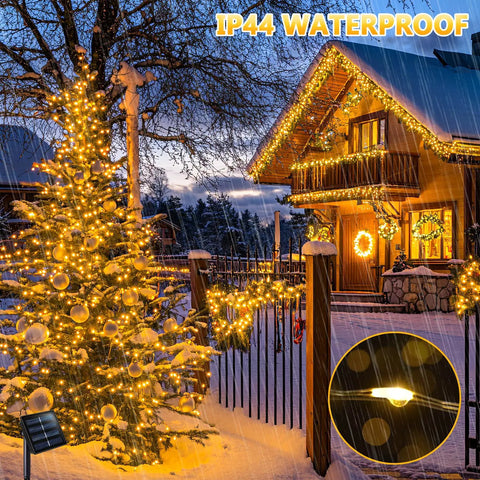 2 Pack Outdoor Solar String Lights With 33 Feet Copper Wire, 100 LED Warm White Fairy Lights decorating house and tree in snow