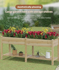 Big Ol Raised Garden Bed With Legs Wooden Planter Stand For Vegetables And Flowers, Large Planter Box With Divider, Liner Bag And Drainage Holes, Plus Bottom Storage Rack For Tools, 72 Inch Wide By 24 Inch Deep By 30.5 Inch Tall, showcasing colorful flowers on grass.