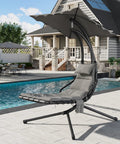 Outdoor Chaise Lounger Swing Chair With Umbrella Canopy near pool; curved steel frame, ergonomic design, hanging lounge with stand.