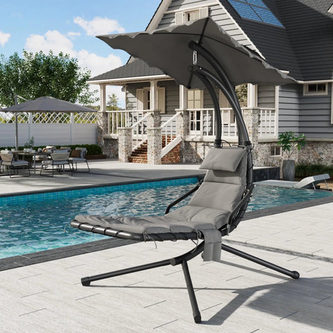 Outdoor Chaise Lounger Swing Chair With Umbrella Canopy near pool; curved steel frame, ergonomic design, hanging lounge with stand.