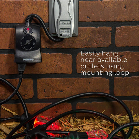 Outdoor Light Sensing Plug In Mechanical Timer With Dual Polarized Outlets For Yard And Patio Lighting mounted on a brick wall.