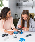 Girls assembling 10 In 1 Rally Racer Model Vehicle Building Kit For Kids, STEM Education Toy For Ages 8 And Up with real motor included.