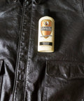 8 oz bottle of Leather Conditioner With Deep Nourishing Moisturizers And Natural Waxes To Restore Dried Leather on a leather jacket