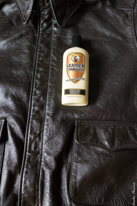 8 oz bottle of Leather Conditioner With Deep Nourishing Moisturizers And Natural Waxes To Restore Dried Leather on a leather jacket