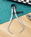 Built Tough Carbon Steel Caliper Kit For Hella Accurate Woodturning showing precise diameter gauges on a cutting mat.