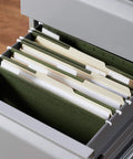Heavy Duty Green Hanging File Folders With Adjustable Tabs And Removable Label Inserts For Standard Letter Size Papers in file drawer.