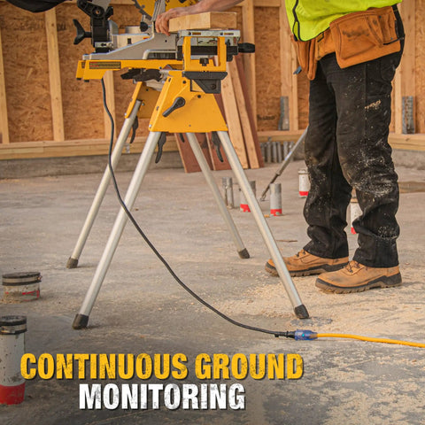 Worker using heavy duty outdoor lighted extension cord 50 foot 12/3 SJTW on job site with tools and construction materials.