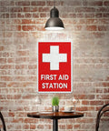 Emergency Medical Facility Sign 8x12 Aluminum Indoor Outdoor Safety Plaque Fade Resistant Wall Marker For Office And Factory Easy Mount Bold Readable Caution Messaging, displayed on a brick wall above a table.