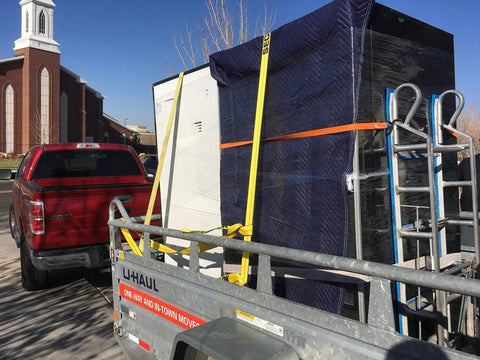 Truck hauling furniture with Heavy Duty 2 Inch Ratchet Tie Down Straps With Double J Hooks 27 Foot 3,333 Lbs Working Load Limit 10,000 Lbs Break Strength DOT CVSA OSHA Certified Built Tough For Trucks Trailers Motorcycles ATVs And Boats 1 Pack