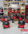 Professional 20 Gallon Wet Dry Shop Vacuum With Six Point Five Peak Horsepower displays multiple units in a garage setup.