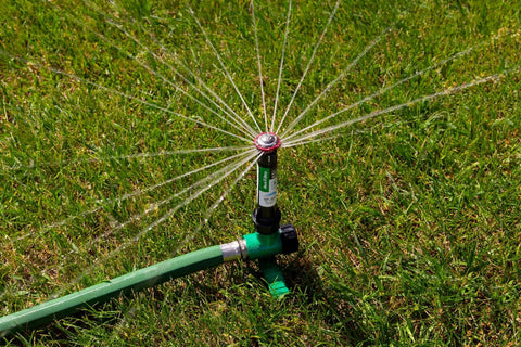 Pro Grade Hose End Sprinkler With High Efficiency Rotary Pattern, Hand Adjustable 45 to 270 Degree Coverage, installed on lawn