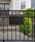 Outdoor Wall Mount Mailbox With Flag Kit And 0 To 9 Number Stickers, mounted on black gate in front of house
