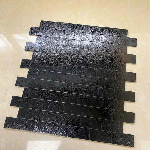 10 Sheet Peel And Stick Backsplash Subway Tile For Kitchen And Bathroom Metal Embossed Bright Black Aluminum Composite 3D Wall Tile No Grout Easy Install DIY Friendly, showing black embossed tiles on floor