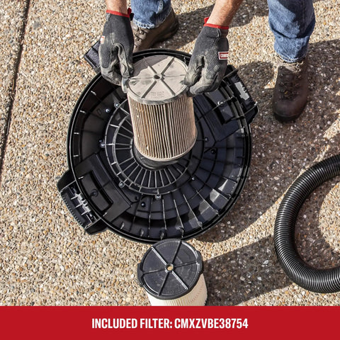 User installing a filter on the Professional 20 Gallon Wet Dry Shop Vacuum on a work surface.
