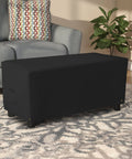 Rectangle Ottoman Cover For Outdoor Patio Furniture in black, on a living room rug, shows heavy duty 12 oz PVC coated polyester.