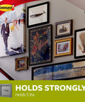 Large Universal Frame Hanger Set With 3 Hangers 6 Strips And 6 Frame Stabilizers For Damage Free Picture Hanging On Walls Doors And Closets 4 Pack Holds Up To 5 Lbs Per Hanger No Holes No Marks Easy To Use displayed on staircase wall with various artworks