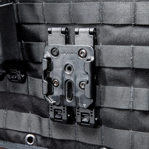 Rock Solid 3 Inch Molle Lok Clips attached to tactical vest webbing, featuring durable nylon and plug-and-play setup.