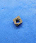 1 Piece Pro Grade PCD Tipped Carbide Turning Insert Diamond Tip CC061600PCD For Precision CNC Turning And Milling In High Performance Tooling With Superior Finish Long Tool Life And Low Friction Wear, square insert on blue mat