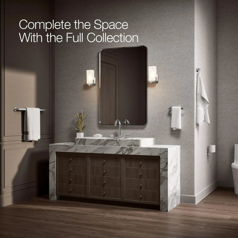 Modern bathroom with marble vanity, mirror, wall sconces, and Composed Double Robe Hook In Polished Chrome Finish, Ultra Durable Bathroom Accessory With Two Hooks To Secure Towels And Robes, Coordinates Perfectly With Composed Collection Faucets And Accessories.