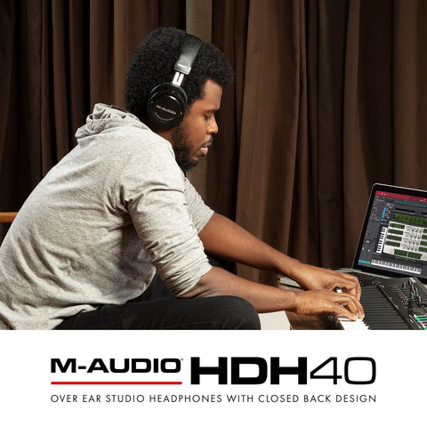 Man using Dope Over Ear Studio Headphones With Closed Back Design, 40mm Neodymium Drivers, at music studio, flexible headband visible.
