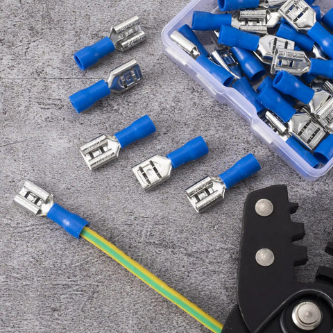 Blue Twenty Pack One Quarter Inch Female Spade Connectors Kit for 22-16 AWG Wire lying on a gray surface, close-up view