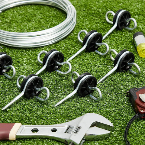 12 Pack Black Electric Fence Insulators With Screws And Post Anchors For Ring Wooden Posts and Gate Handles on grass