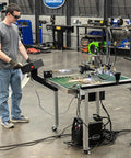 Person operating Versa-Cut 2 By 2 CNC Plasma Table For Metal Cutting With Garage-Grade Precision, LCD screen attached. Workshop setting.