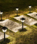 Solar Pathway Lights 4 Pack Outdoor Garden LED Lights IP65 Waterproof Glass And Metal Walkway Landscape Lighting at sunset