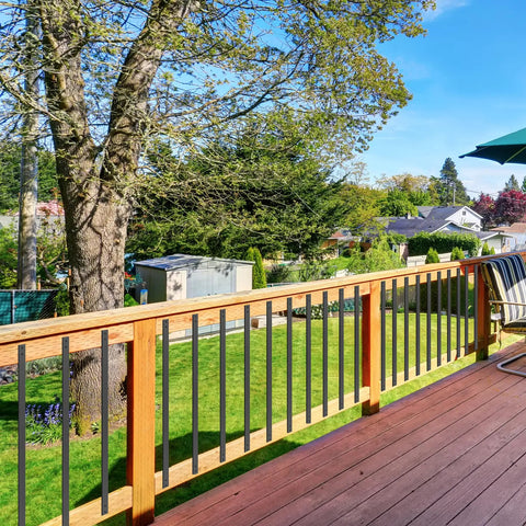 View of a deck with Built Tough Sixty One Pack Heavy Duty Black Metal Deck Balusters Plus Mounting Bolts 32 Inch railing spindles.