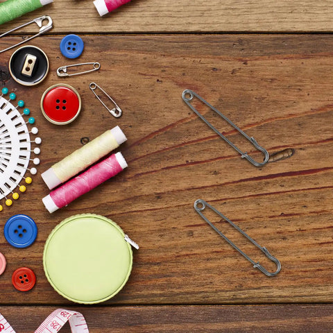Luxurious Heavy Duty Safety Pins For Women Thick Iron Sweater Clips For Scarves Bags DIY Crafts And Outdoor Wear Secure Closure With Precision Opening Mechanism on a wooden table.