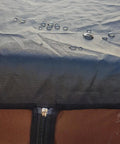 Water droplets on waterproof roof of Bug Free Patio Swing Mosquito Netting With Zipper Door And Waterproof Roof For Outdoor Porch Swing 3 Seater 49.2x80.7x80.7 Inches Ultra Fine 1mm Mesh For Airy Comfort