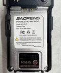 Back of a handheld radio showing model details and certifications, related to 8 Watt Dual Band Handheld Radio Kit With Beefed Up Large Battery Upgrade VHF 136 174 MHz UHF 400 520 MHz Hardened Durable Shell V85 High Gain Antenna Full Accessory Pack Programming Cable Included USA Support