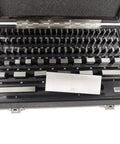 81 Piece Gauge Block Set In Inch Sizes Crafted From Hardened Alloy Tool Steel Built Tough With Dead On Precision Calibration Certified For Serious Machinists And Dimensional Metrology Shops in a protective case showing various sizes.