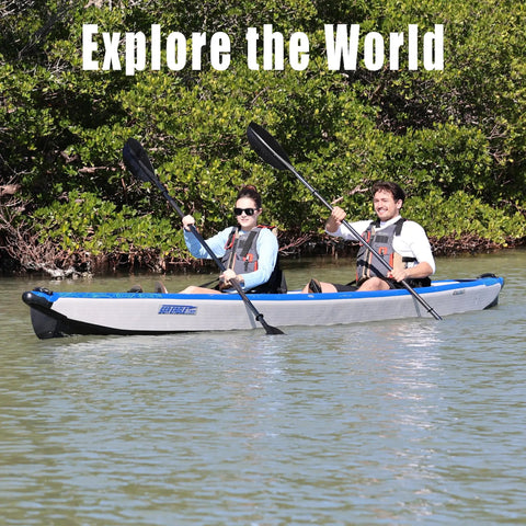 Couple paddling Razorlite 473rl Inflatable Drop Stitch Kayak Pro Package with Ultra Portable Rigidity on a calm lake.