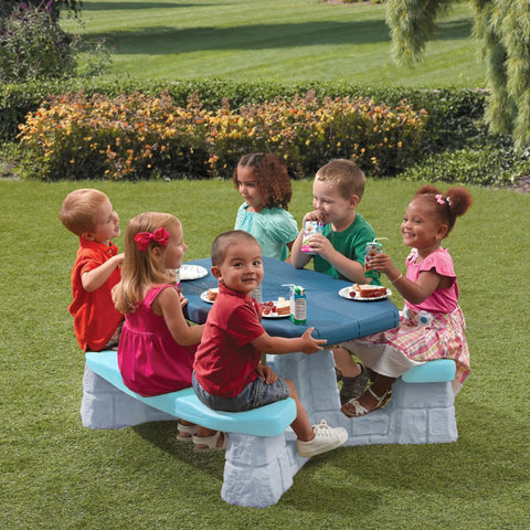 Children dining at Sun And Fun Picnic Table With Umbrella For Indoor And Outdoor Use Toddler Sized Table With Five Foot Shade Canopy.