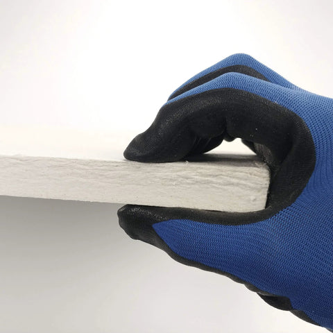 Side view of Lynn Manufacturing ceramic fiber board insulation, 20x20x3/4 in, gray board held by blue-gloved hand