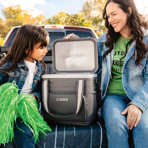 MagSnap Magnetic No Zip Soft Cooler for 24 Cans With Insulated Hard Liner Ice Chest on truck tailgate with mother and child