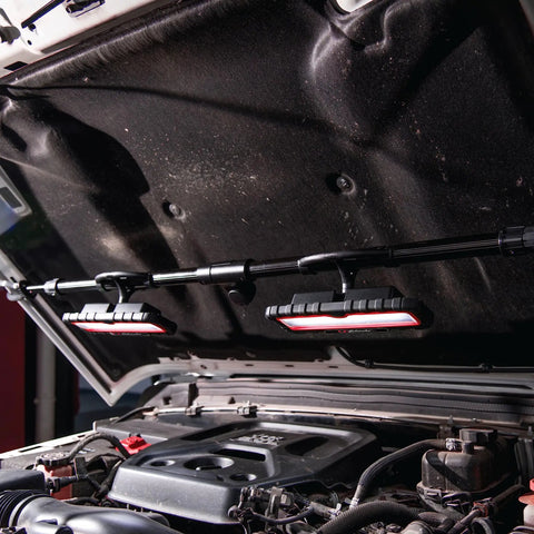 Portable Under The Hood LED Work Light With Dual 1200 Lumen LEDs mounted on car hood, showing magnetic and extendable arm mounts.