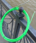 Aewio 15 Meter Fishing Tape With 4.5mm Diameter For Electrical Wire Pulling and Line Threader on railing, showing its flexibility and nylon core.