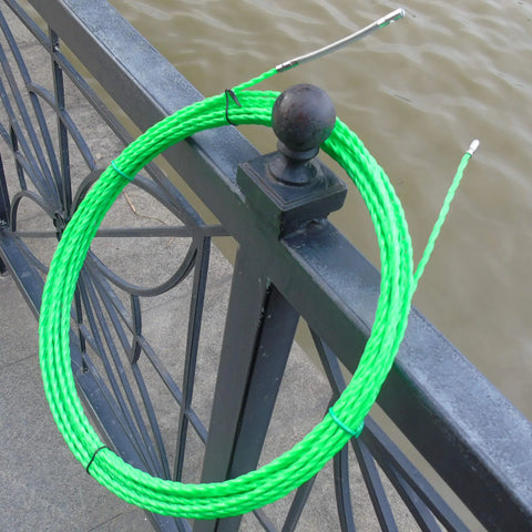 Aewio 15 Meter Fishing Tape With 4.5mm Diameter For Electrical Wire Pulling and Line Threader on railing, showing its flexibility and nylon core.