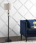 60 Inch Oil Rubbed Bronze Mercury Glass LED Floor Lamp With Grey Linen Drum Shade next to a blue sofa in a living room