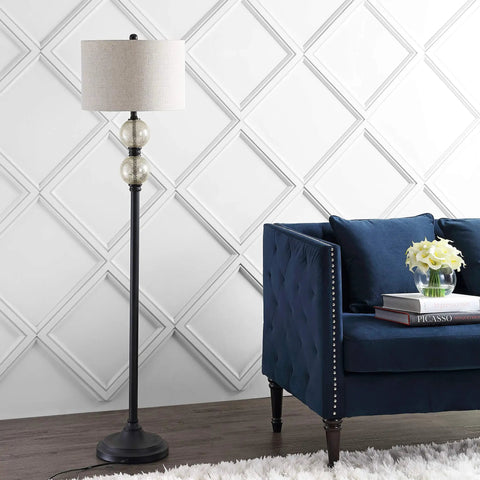 60 Inch Oil Rubbed Bronze Mercury Glass LED Floor Lamp With Grey Linen Drum Shade next to a blue sofa in a living room