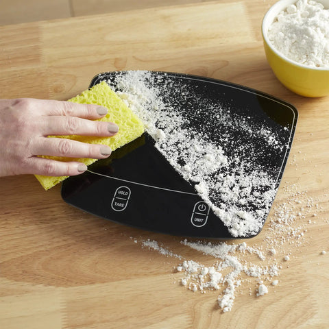 Waterproof Digital Kitchen Scale with 11 Pound Capacity Pro Grade Precision Ultra Accurate to 0.01 Oz and 1 Gram Tare Function being cleaned