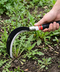 Two Piece Hand Sickle Garden Tool Set No Nonsense Heavy Duty Manganese Steel Weed Cutter in use on garden weeds