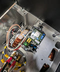 Internal view of Top Shelf Pto Generator With Auto Voltage Regulator and 16 Kw Continuous Power showcasing copper coils and wiring.