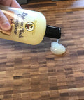 Butcher Block Conditioner 12 Ounce 5 Pack being applied to wood countertop, food safe oil treatment to restore moisture.