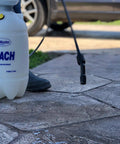 1.5 Gallon Bleach Sprayer Handheld Chemical Sprayer with Viton Seals, person using lightweight white sprayer for cleaning outdoors